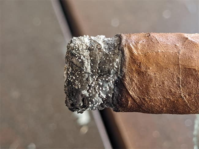 white dots on cigar ash